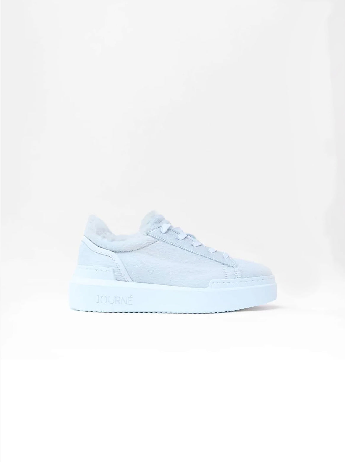 Emilie Sneaker Creme – Seitenansicht mit weißer Sohle