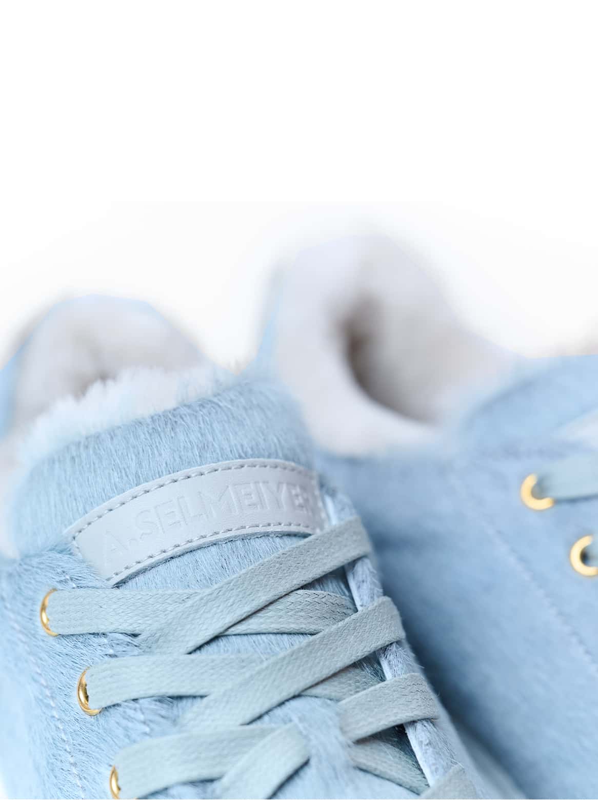 Francesco Sneaker Grau – Detail des Lammfellfutters und Labels